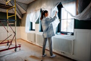 A woman working on a home improvement project | Home upgrades